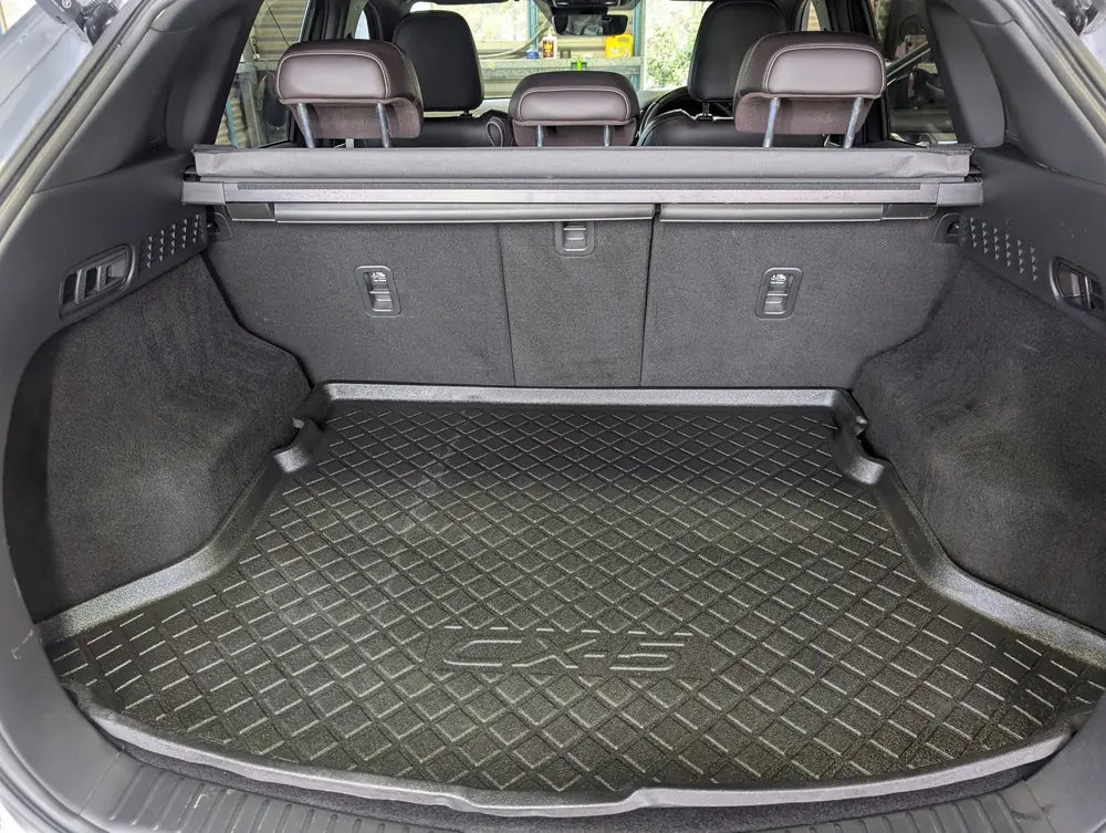 Clean SUV cargo area with rubber load mat
