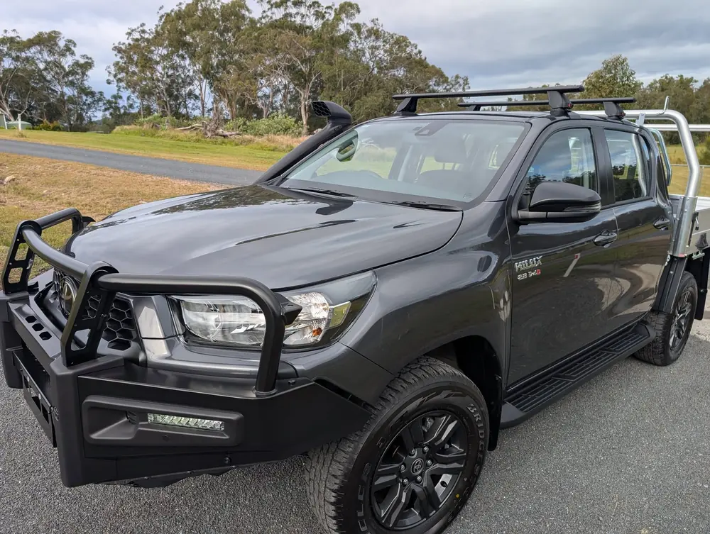 Grey dual-cab ute parked outside after detailing